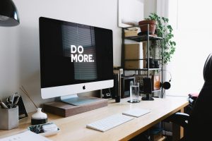 Image of desk set up with computer sayiong do more